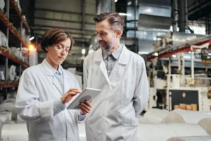 A pair of engineers performing quality control on products